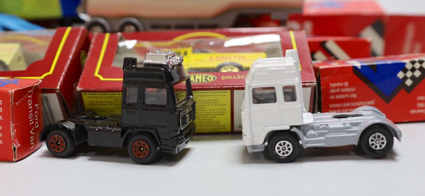 A quantity of corgi cars and trucks